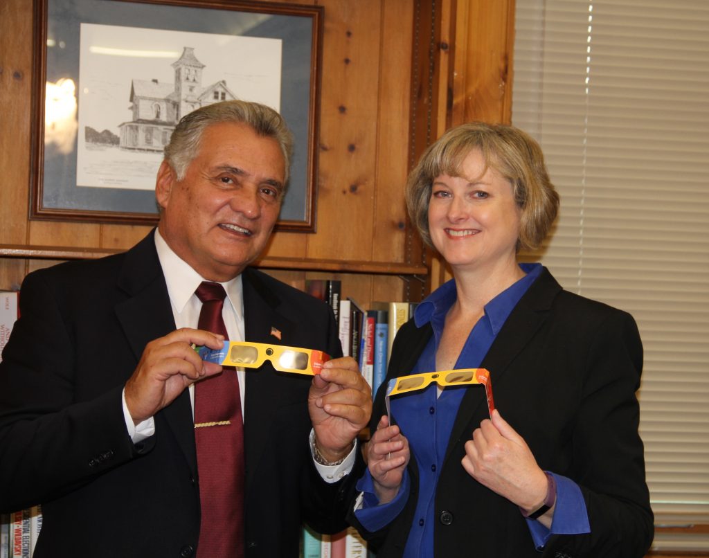 Ocean County Freeholder Director Joseph H. Vicari and Ocean County Library Director Susan Quinn check out the “Eclipse Shades” that were distributed by the Ocean County Library. (Photo: Ocean County)