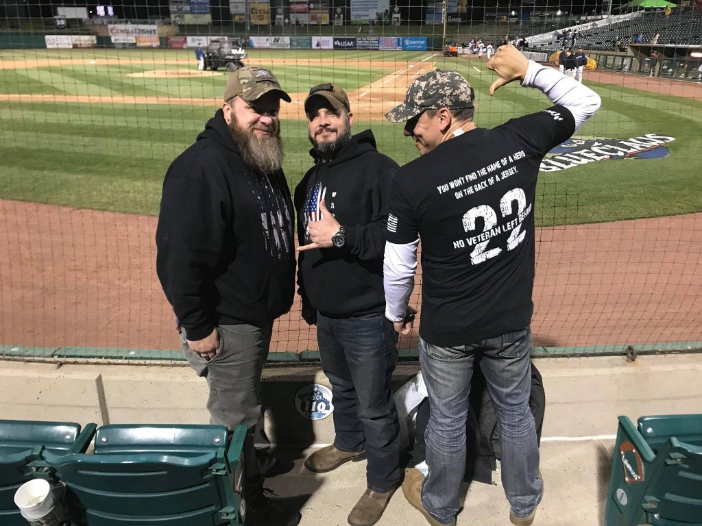 Ma Deuce Deuce President Dennis Addesso, at left, welcomes two fellow veterans to enjoy seats at First Energy Park for a recent Blue Claws minor league baseball game, as part of a night out the nonprofit provides. Photo credit: Ma Deuce Deuce.