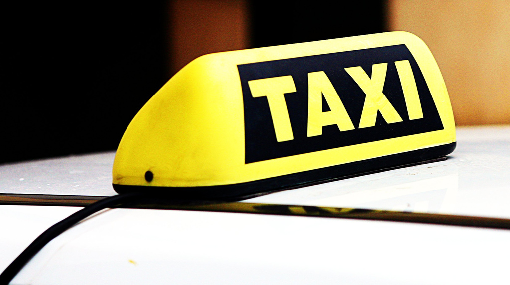 A taxi sign. (Credit: Leonid Mamchenkov/ Flickr)