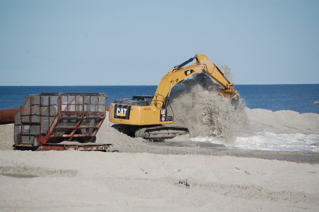 Crews work on a beach and dune replenishment project in Long Beach Township, Oct. 15, 2015. (Photo: Daniel Nee)