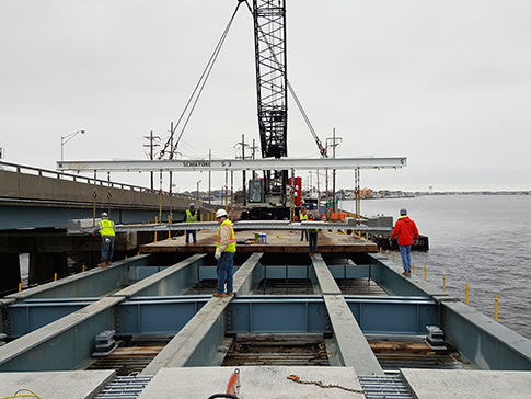 Workers placing a new deck on the Mathis bridge that carries Route 37 over Barnegat Bay. (Photo: NJDOT)