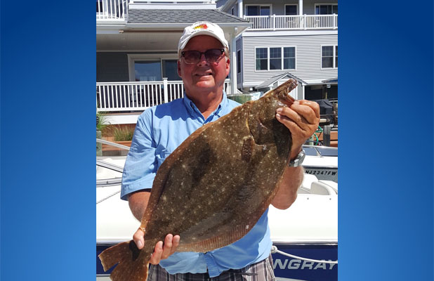 Local resident Mick Martino and his doormat fluke, caught off Lavallette, Aug. 2017. (Photo: Mick Martino)