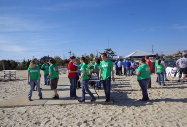 Volunteers clean up a Toms River beach during one of several annual beach sweeps. (Photo: Toms River Twp.)