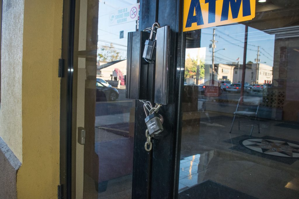 A chain and lock on the door of the Red Carpet Inn after being purchased by the municipal government of Toms River, Oct. 29, 2018. (Photo: Daniel Nee)