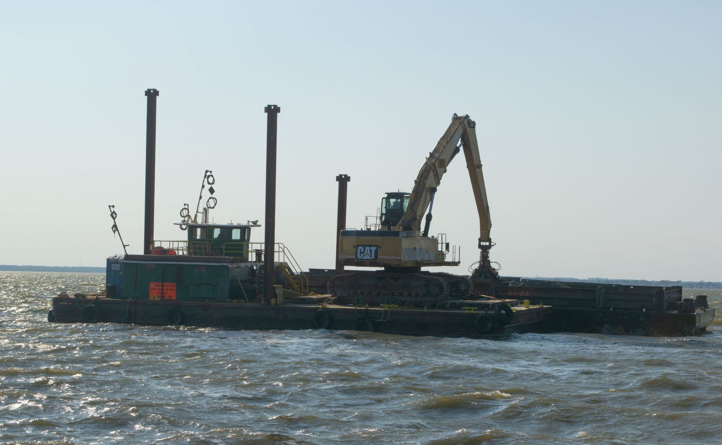 A dredge boat empties material at Bayside Park, Oct. 2020. (Photo: Daniel Nee)