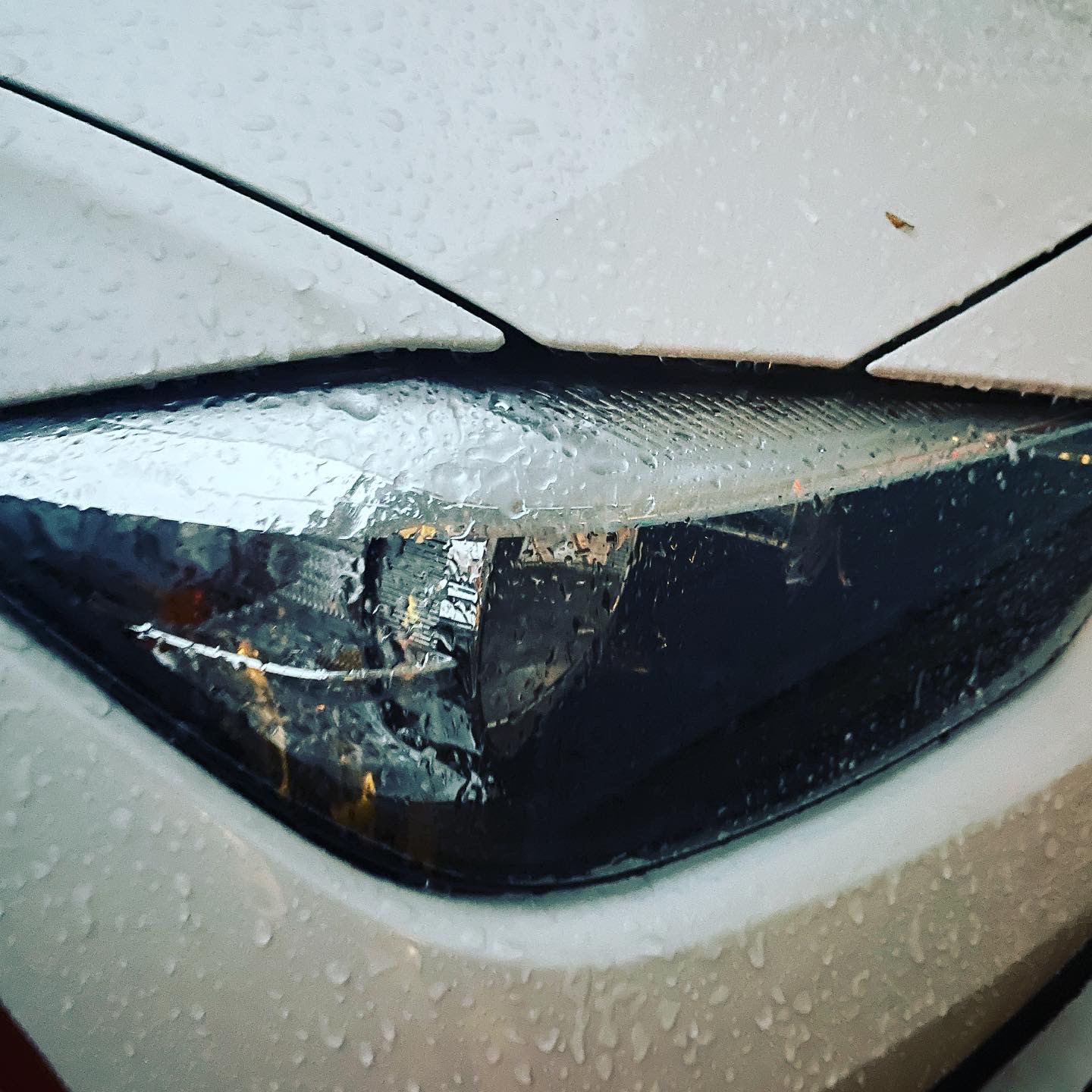 Ice from freezing rain forms on a car's headlight. (Photo: Daniel Nee)