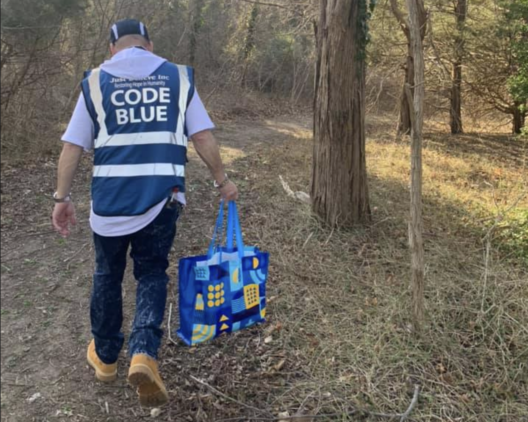 Volunteers with Toms River's Code Blue program operate in a wooded area. (Photo: Just Believe Inc./ Facebook)