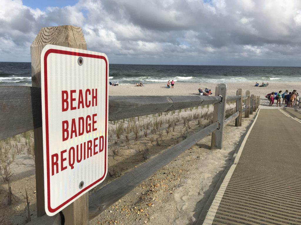 A beach badge sign on the Ortley Beach oceanfront. (Photo: Daniel Nee)