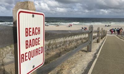 A beach badge sign on the Ortley Beach oceanfront. (Photo: Daniel Nee)