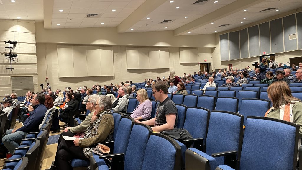 A crowd gathers at Toms River High School North at a 'Speak Out' forum on the Ciba-Geigy settlement, Jan. 25, 2023. (Photo: Daniel Nee)