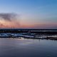 Smoke from a fire in Lakewood rises over Barnegat Bay around 5 p.m., Jan. 8, 2024. (Photo: Shorebeat)